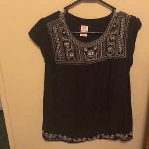 Black shirt with white embroidered details